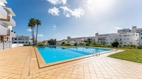 Sunny Retreat with Pool and Balcony by LovelyStay